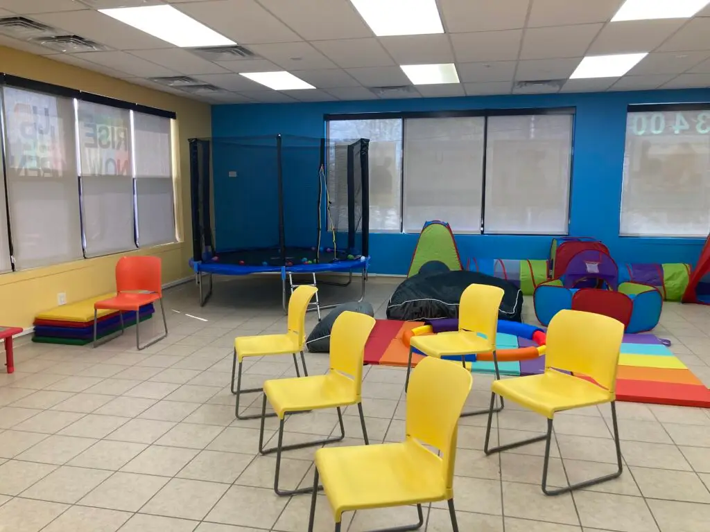 a-room-filled-with-lots-of-different-colored-chairs