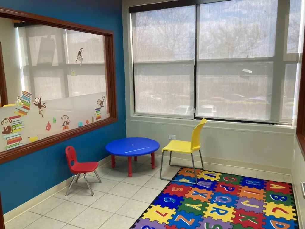a-child's-playroom-with-a-play-table-and-chairs